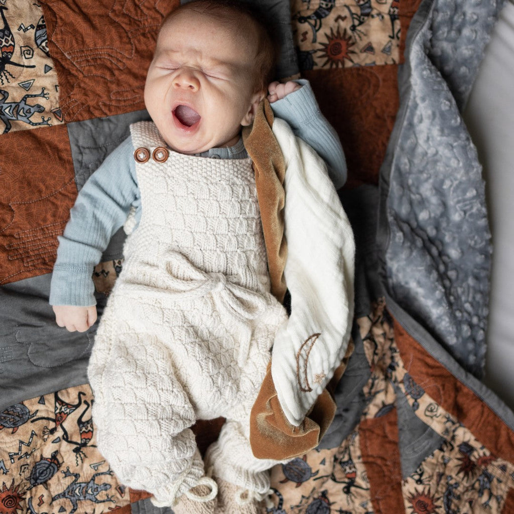 Hand-knit gender-neutral Dakota Playsuit by JuneBee Baby -- a perfect Christmas gift for expecting moms