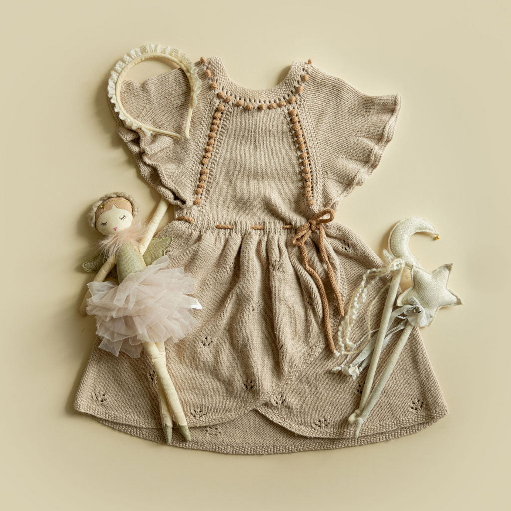 Envelope Dress — hand-knit cotton bamboo wrap style dress with flute sleeves, popcorn knit details, and drawstring waist for baby, kids & dolls by JuneBee Baby.