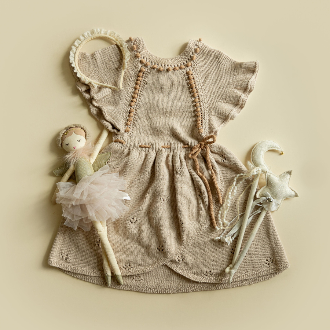 Envelope Dress — hand-knit cotton bamboo wrap style dress with flute sleeves, popcorn knit details, and drawstring waist for baby, kids & dolls by JuneBee Baby.