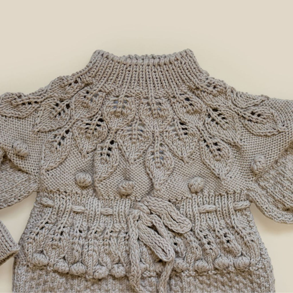 Hand-knit Shirley Romper in Light Clay, crafted from natural cotton bamboo fibers by JuneBee Baby