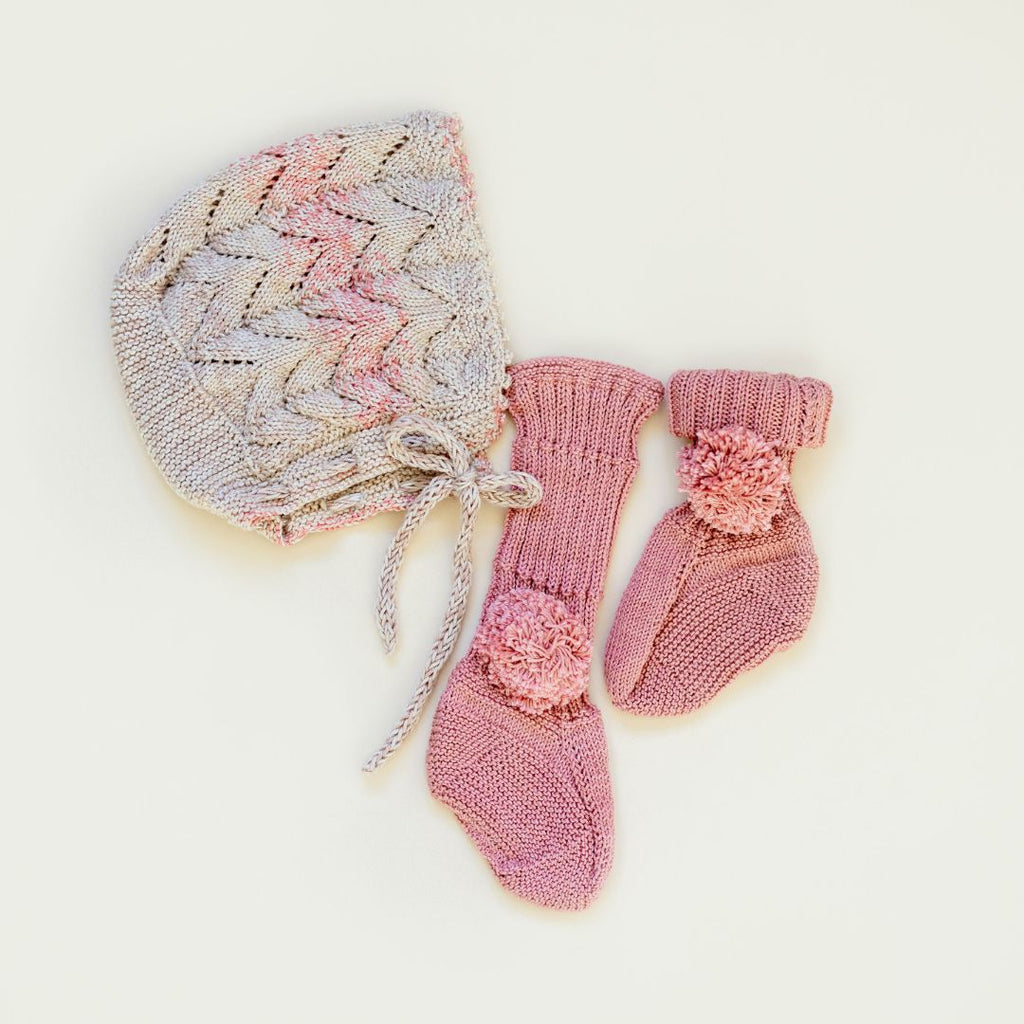 Hand-knit cotton bamboo baby bonnet and bed socks by JuneBee Baby — soft, breathable heirloom accessories for newborns.