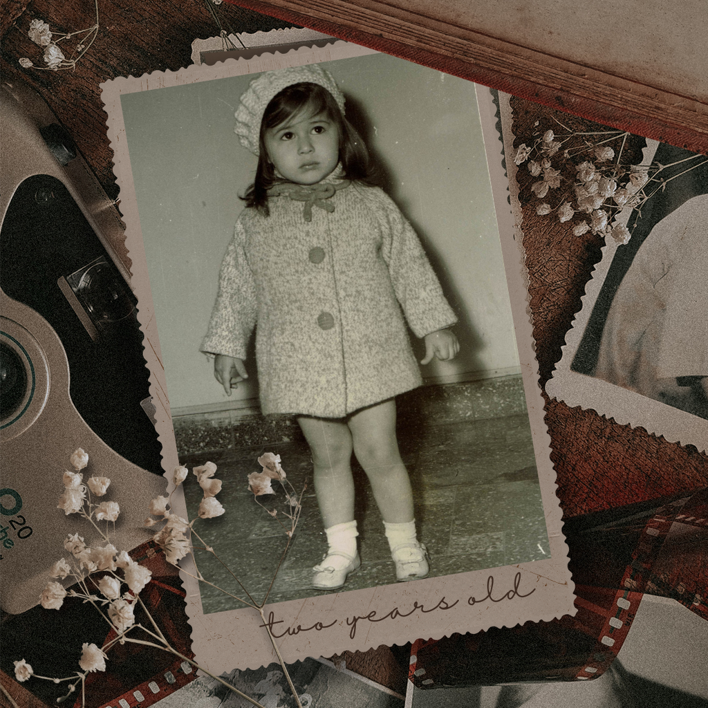June at age two wearing a hand-knit sweater made by her mom - the inspiration behind JuneBee Baby artisan knits
