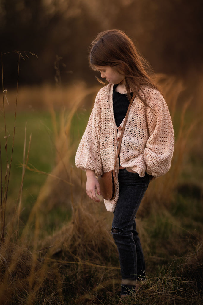 Hand-knit Katy Cardigan for children and women by JuneBee Baby - soft cotton bamboo artisan knitwear in light peach.