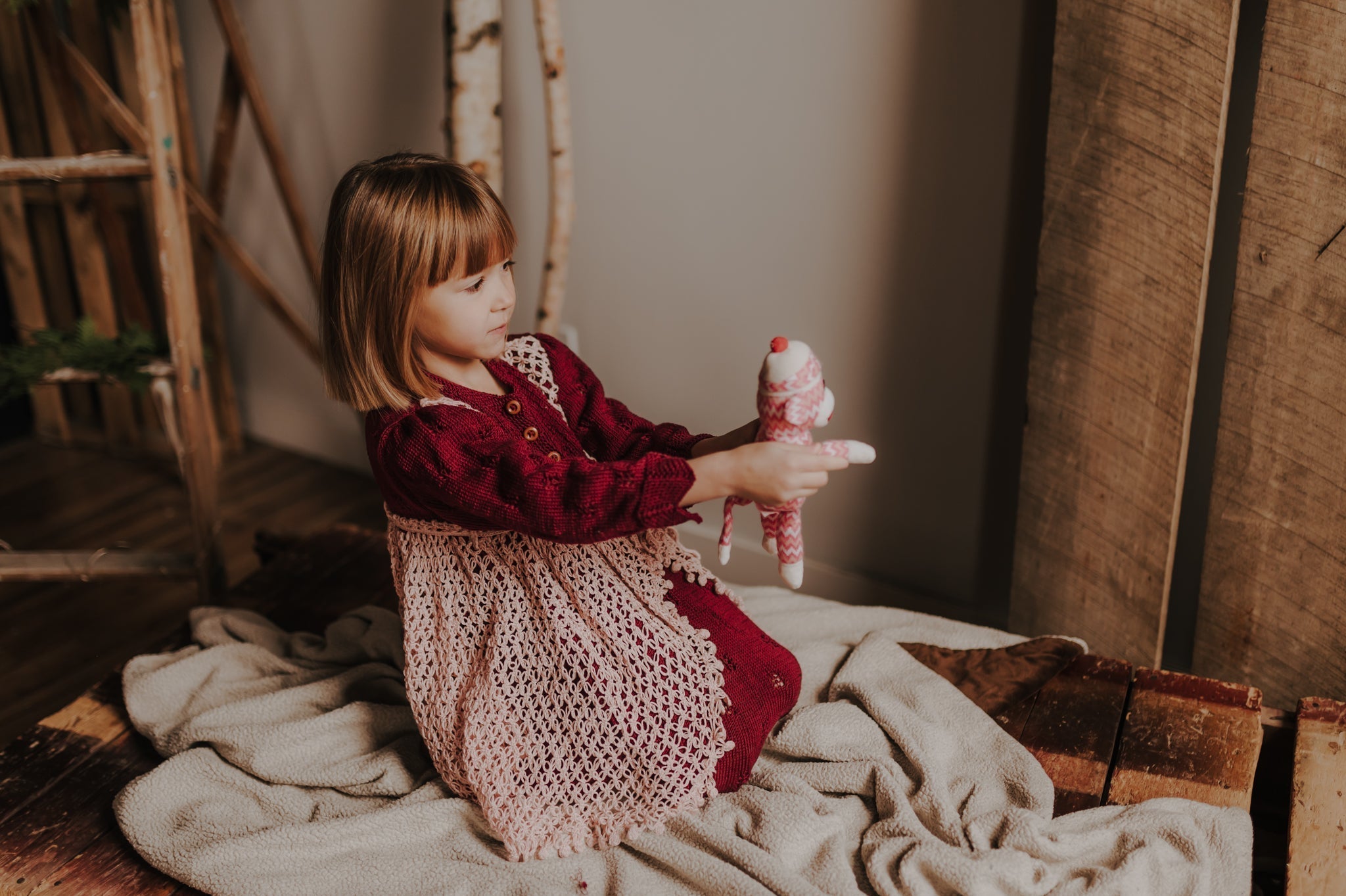 Hand knitted children's Lavinia Dress with crocher overlay.
