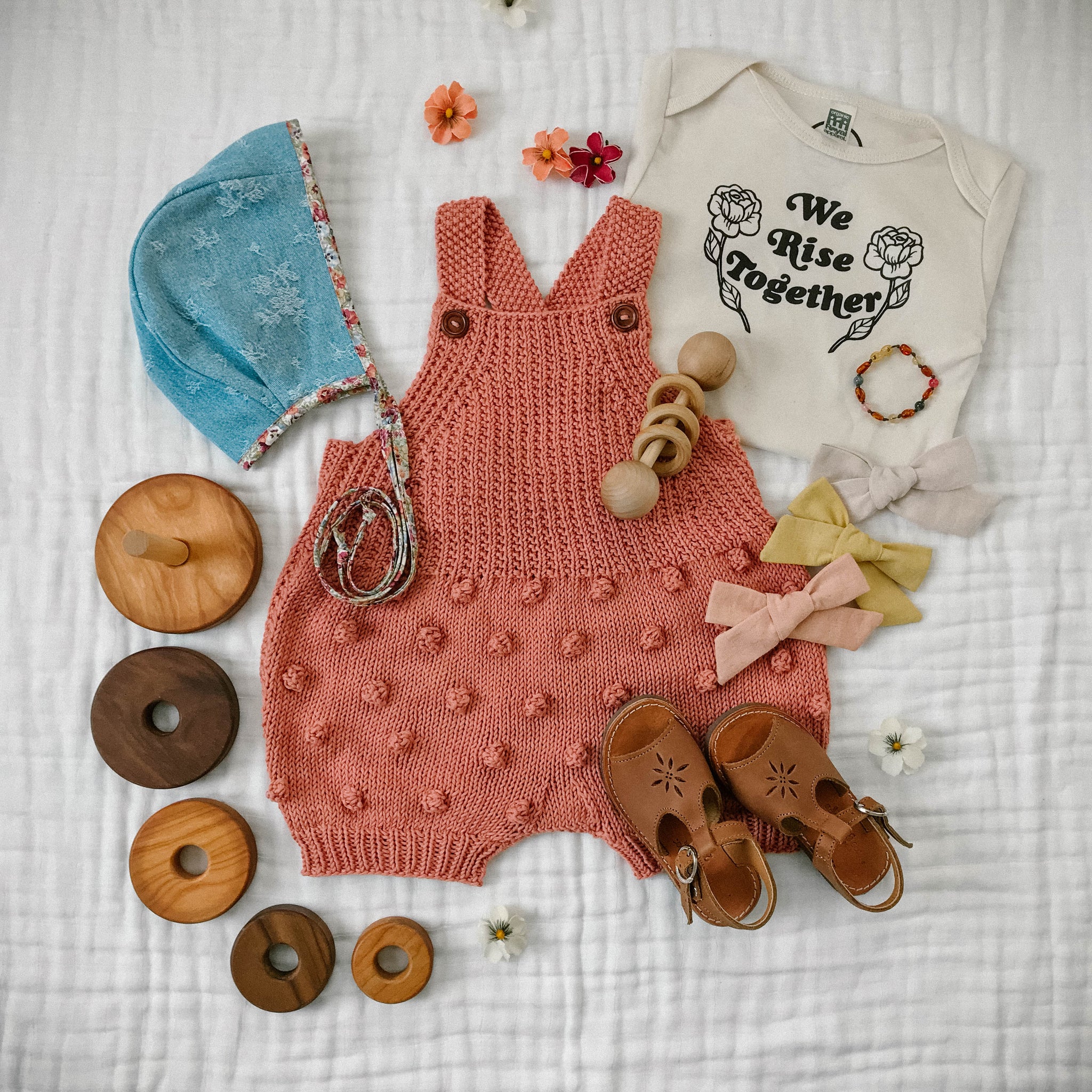 JuneBee Baby Madison Romper in terracotta - handknit baby romper in warm earthy tones