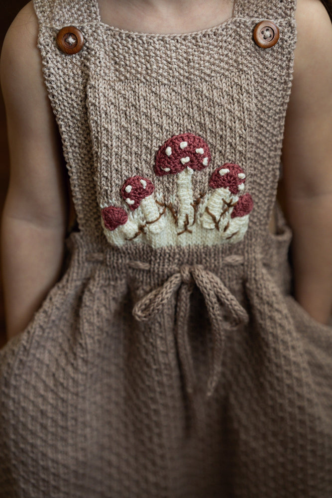 Mushroom Pinafore - hand-knit cotton bamboo pinafore with adjustable straps and mushroom motifs for girls