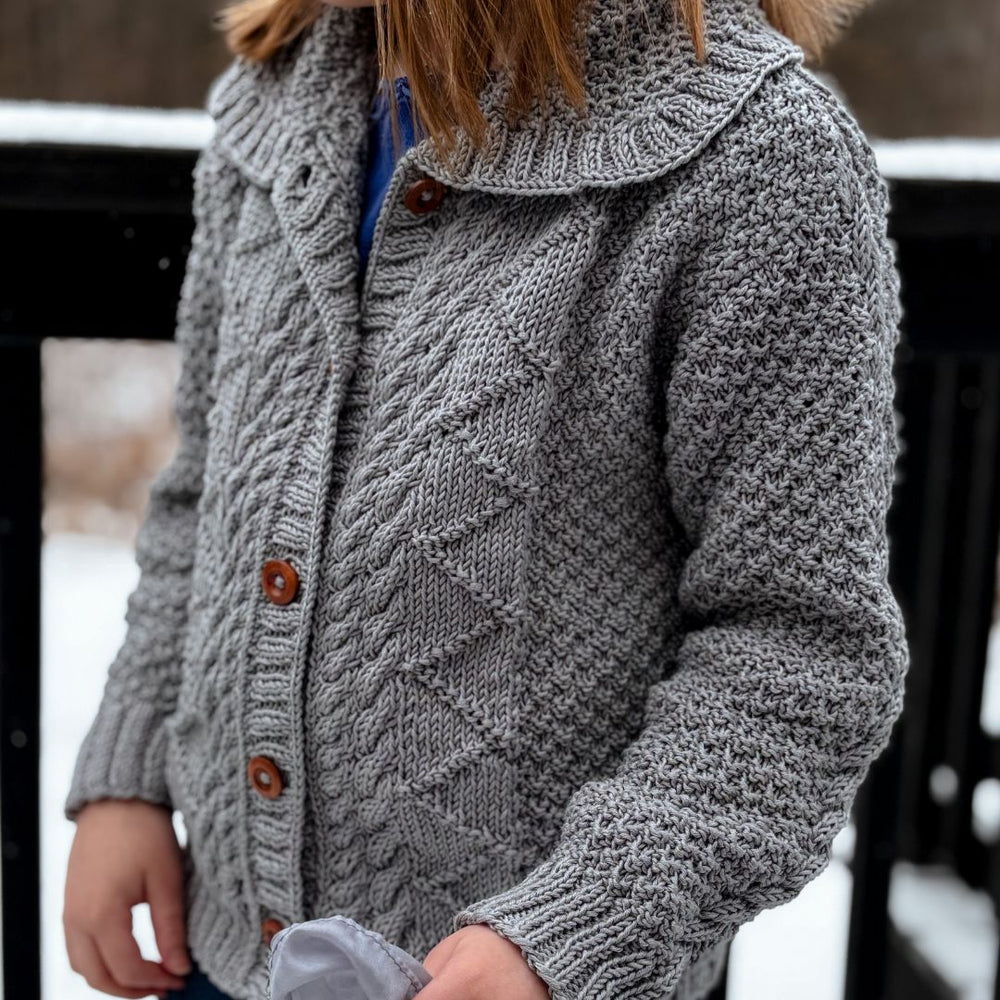 Gender-neutral hand-knit cotton bamboo children's cardigan by JuneBee Baby — sustainable, breathable, heirloom quality knitwear.
