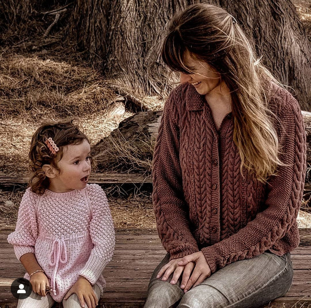 June from JuneBee Baby wearing the Ada Cardigan — handmade cotton bamboo knitwear for women and children.