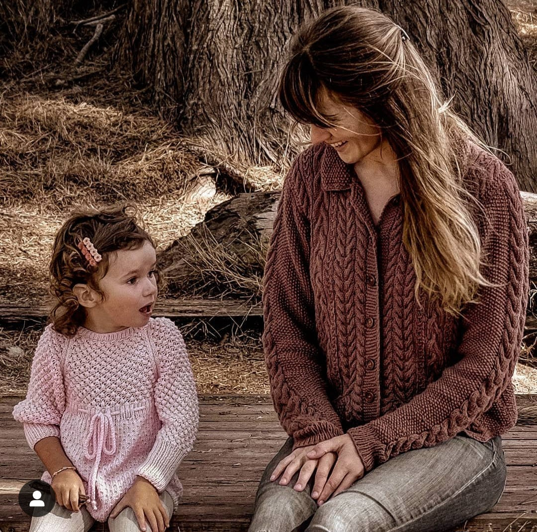 June from JuneBee Baby wearing the Ada Cardigan — handmade cotton bamboo knitwear for women and children.