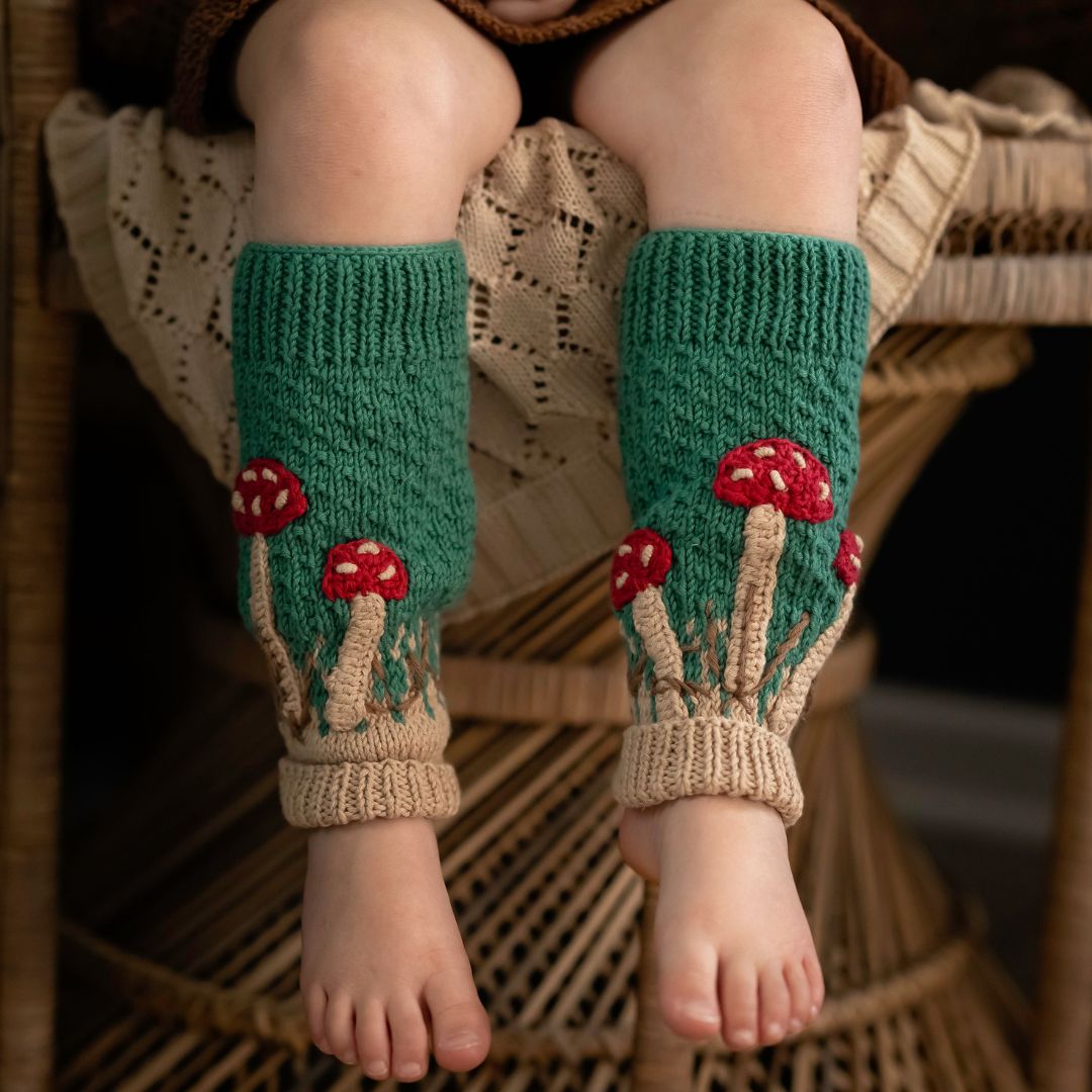 Toddler girl wearing hand-knit mushroom leg warmers hunter green cotton bamboo, baby girl mushroom outfit.