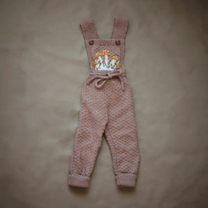 Flat lay of hand-knit mushroom romper in blush brown cotton bamboo, baby mushroom outfit by JuneBee Baby