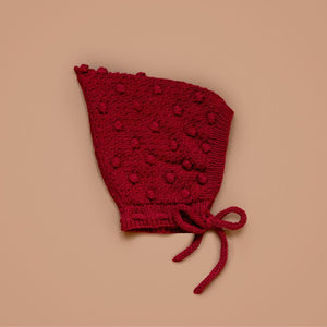 Hand-knit popcorn pixie hat in red cotton bamboo for babies and toddlers by JuneBee Baby.