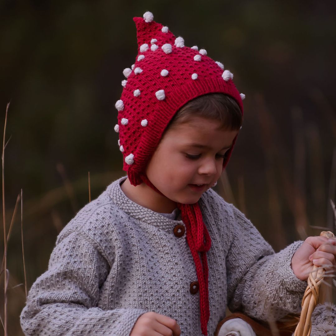 Mushroom inspired hand-knit popcorn pixie hat in red and cream cotton bamboo for babies and toddlers by JuneBee Baby.