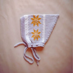 Picture of hand-knit snowflake motif on gray Nordic pixie hat in cotton bamboo
