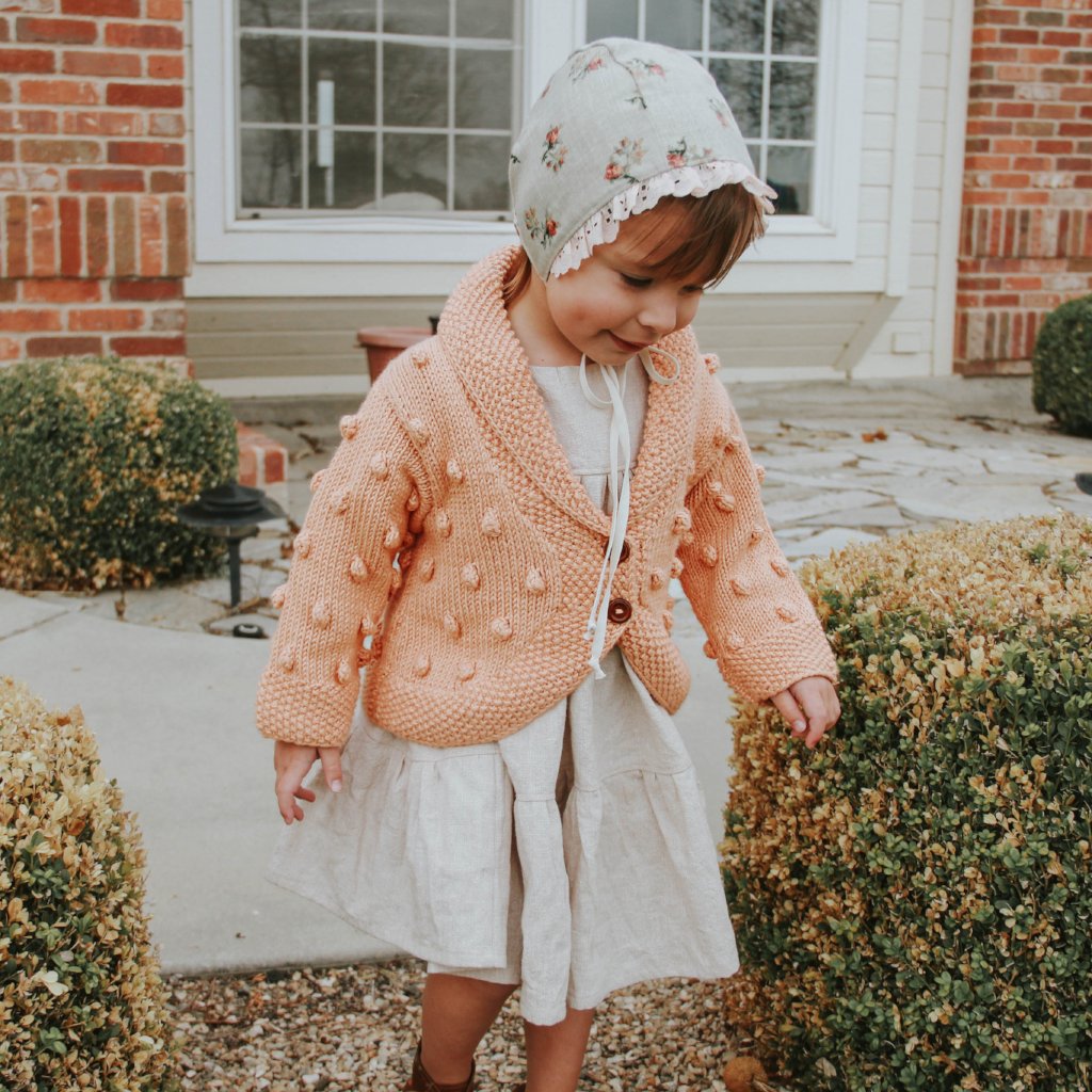 Bella shawl collar baby cardigan in peach with wooden buttons - JuneBee Baby
