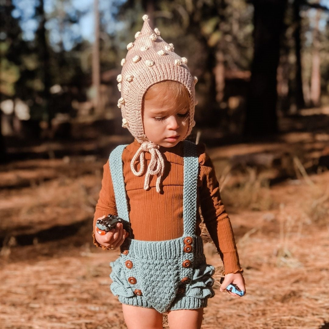 Hand-knit popcorn pixie hat in blush beige and cream cotton bamboo for babies by JuneBee Baby.