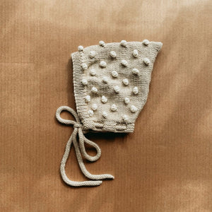 Hand-knit popcorn pixie hat in oatmeal and ivory cotton bamboo for babies and kids by JuneBee Baby.
